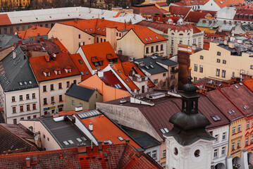 Fototapeta na wymiar Top view of red terracotta roofs in Czech Republic, aerial view of old town architecture