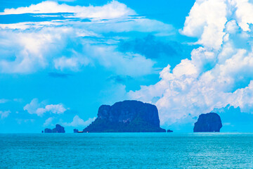 Tropical paradise turquoise water beach and limestone rocks Krabi Thailand.