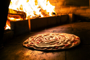 Pizza em forno a lenha