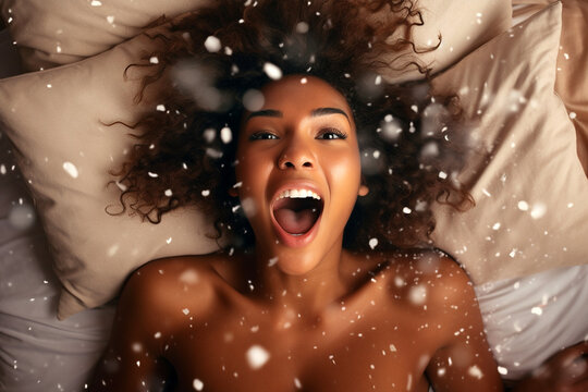 African american woman having orgasm. Woman with open mouth and closed eyes enjoying sex lying among flying glitter and sparkles as a symbol of orgasm. Sexual experience, masturbation, cunnilingus.