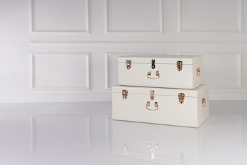 Two white vintage stacked suitcases