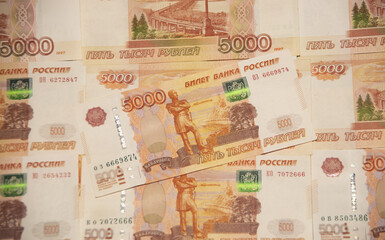 Ruble. Banknotes of the Bank of Russia are on the table, five thousand rubles, a lot of Russian...