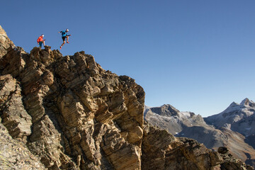 Athletes jumping the mountains