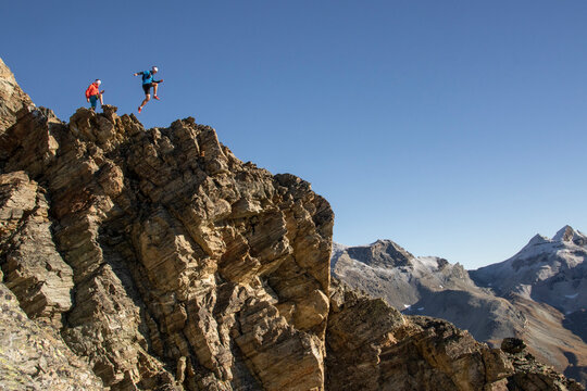 Athletes jumping the mountains