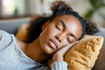 Obraz na płótnie Canvas Relaxed tired young african american woman napping on comfortable sofa with eyes shut closed. Calm lazy black girl leaning on couch in living room enjoying chill sleeping resting at home concept