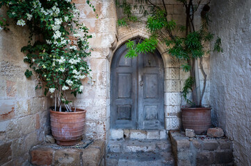 Old door in the fabulous Lindos city. Charming streets.