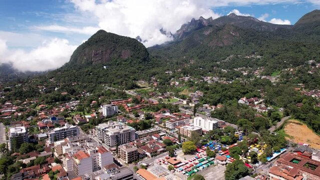 Aerial drone orbit of stands in the Feira do Alto in Teresopolis, Rio de Janeiro, Brazil revealing surrounding mountainous tropical landscape