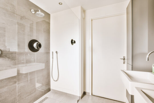 White bathroom with shower and sink