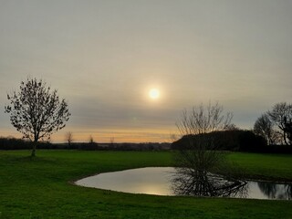 sunset over flooded golf course