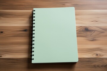 Minimalist workspace A notebook placed top view on the wooden floor