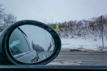 Side mirror of a car.Traveling by car in summer.View from the car.sunny weather.Off-road.Problems on the road.Automotive.View from the car window.Sad mood.on the road.auto trip.sunny mood.
traffic.
