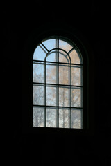 Winter birch trees outside the window of Kapp Church, Toten, Norway.
