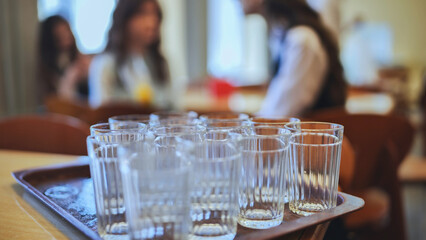 Glass tumblers in the school cafeteria.