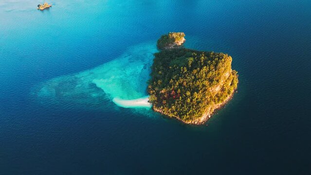 Raja Ampat, Indonesia. Aerial view of the island with tiny perfect beach in West Papua, Misool, Indonesia