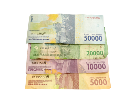 There are four stacks of indonesian rupiah paper currency