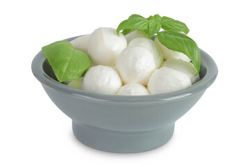 Mini mozzarella balls with basil in a grey ceramic bowl isolated on white background with full depth of field.