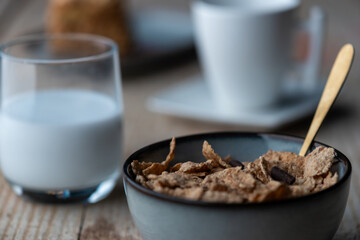 Tasty cornflakes with milk,Tasty cornflakes with milk in bowl served on wooden table, flat lay,healthy breakfast,healthy morning, breakfast served in the restaurant