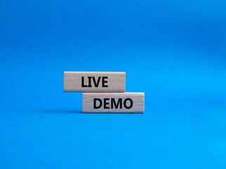 Live Demo symbol. Concept word Live Demo on wooden blocks. Beautiful blue background. Business and...