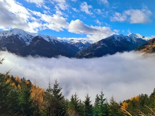 Beautiful landscape in the Carinthian Mountains, summits over a sea of fog, Carinthia, Austria, Europe. A sea of fog covering the valley Mölltal
