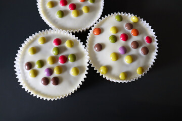 Easter background. small Easter cupcakes and chocolate eggs