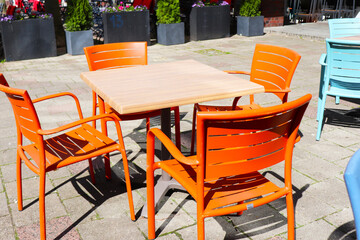 empty tables of summer street cafes on urban streets