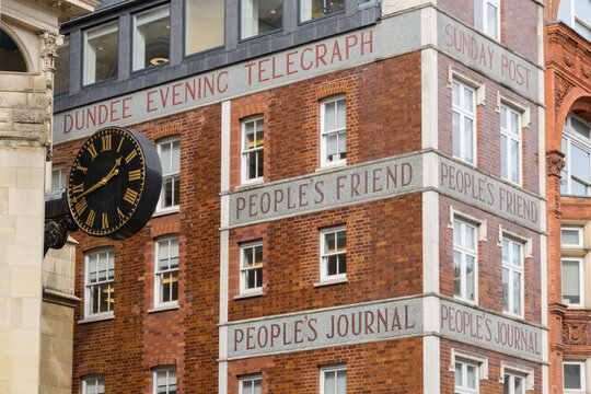 London, UK - March 16 2023; Titles of DC Thomson newspapers on building wall in Fleet Street