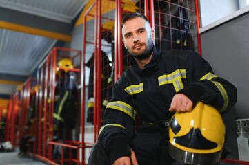 fireman sitting on bench at fire station