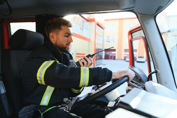 Firefighter drives a emergency vehicle with communication interior view