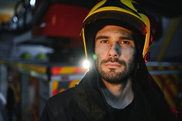 Firefighter rests after fighting a house fire