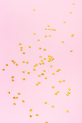 Sparkle stars shape on a pink background. Happy new year background