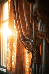 Sunlight shining through curtains in a room. Can be used to depict a cozy and peaceful atmosphere