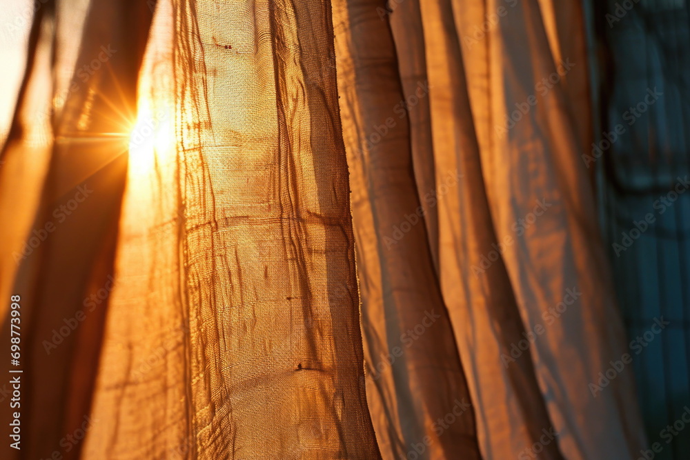 Poster Sunlight shining through curtains in a room. Can be used to depict a bright and inviting atmosphere.