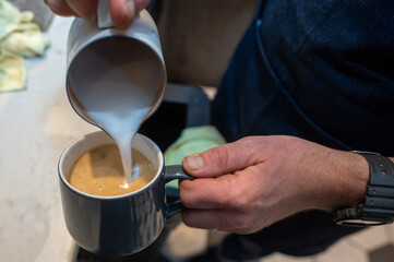 Fototapeta na wymiar pouring coffee into a cup