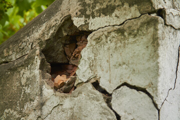 Big deep crack on wall of an old building, ancient ruins. Concept: life in wartime the war in Ukraine. High quality photo