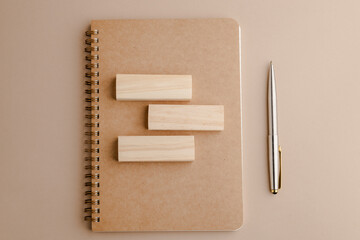 Mockup blank space on a spiral notebook.  template on sketch book, vertical full page with a silver pen. Top view of paper for draw, note, to-do list for creative design and idea memo concepts. - obrazy, fototapety, plakaty