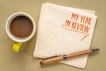 my year in review - a note on a napkin with coffee, end of year personal exeperience and story...