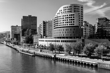 View of the Nervion river crossing the city of Bilbao in the Basque Country. Spain. Black and white.