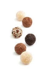 Typical Brazilian sweet brigadeiro. Assorted flavors of candies on a white background