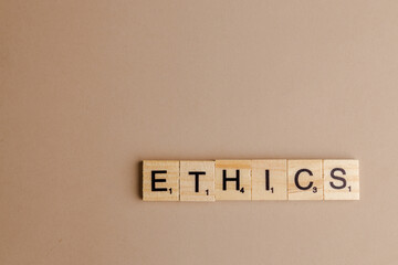 ETHICS wood word on compressed board