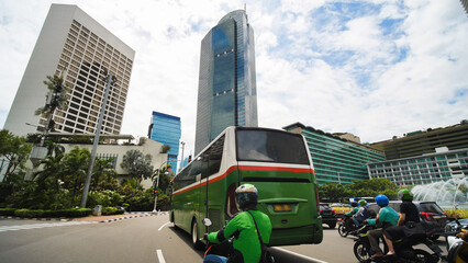 Jakarta's roads and streets with cars during the daytime.