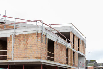 New building in progress, construction of apartments, construction started, building in shell, apartment prices, construction works,New building in progress,Bricks and concrete