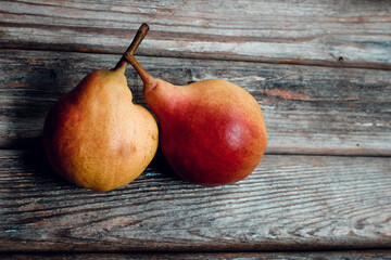 Ripe pear on a wooden table