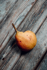 Ripe pear on a wooden table