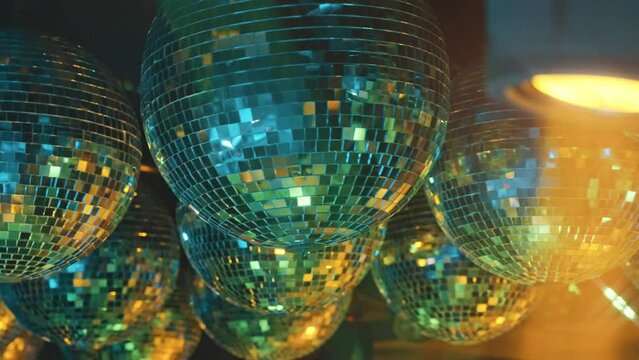 Mirror balls and stage lights at party