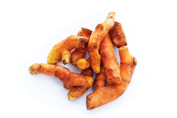 Turmeric roots on white background.