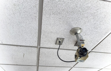 Security camera overlooking urban street, surveillance technology, safety monitoring, privacy,...