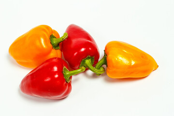 Red and yellow bell pepper on a white background