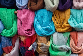 Multicolored scarves, Multicolored scarves displayed hanging in the Market Square, scarves in...