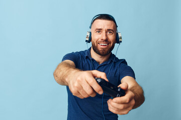 Background person gamer earphones adult entertainment caucasian joystick expression men young console lifestyle men © SHOTPRIME STUDIO
