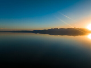 Fototapeta na wymiar Aerial view over Salton sea in California. Huge lake in the middle of a desert at sunset.